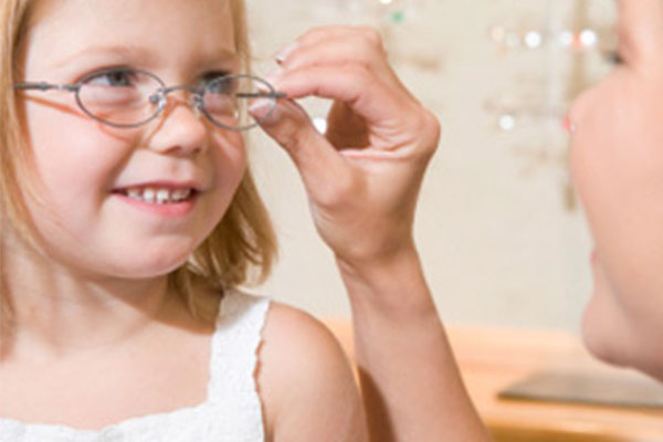 Children picking out glasses